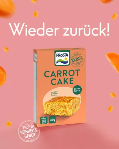 Eine Schachtel FRoSTA Carrot Cake, ein Highlight unter den FRoSTA-Produkten, auf pinkem Grund mit Möhrenstücken und "Wieder zurück!" oben.